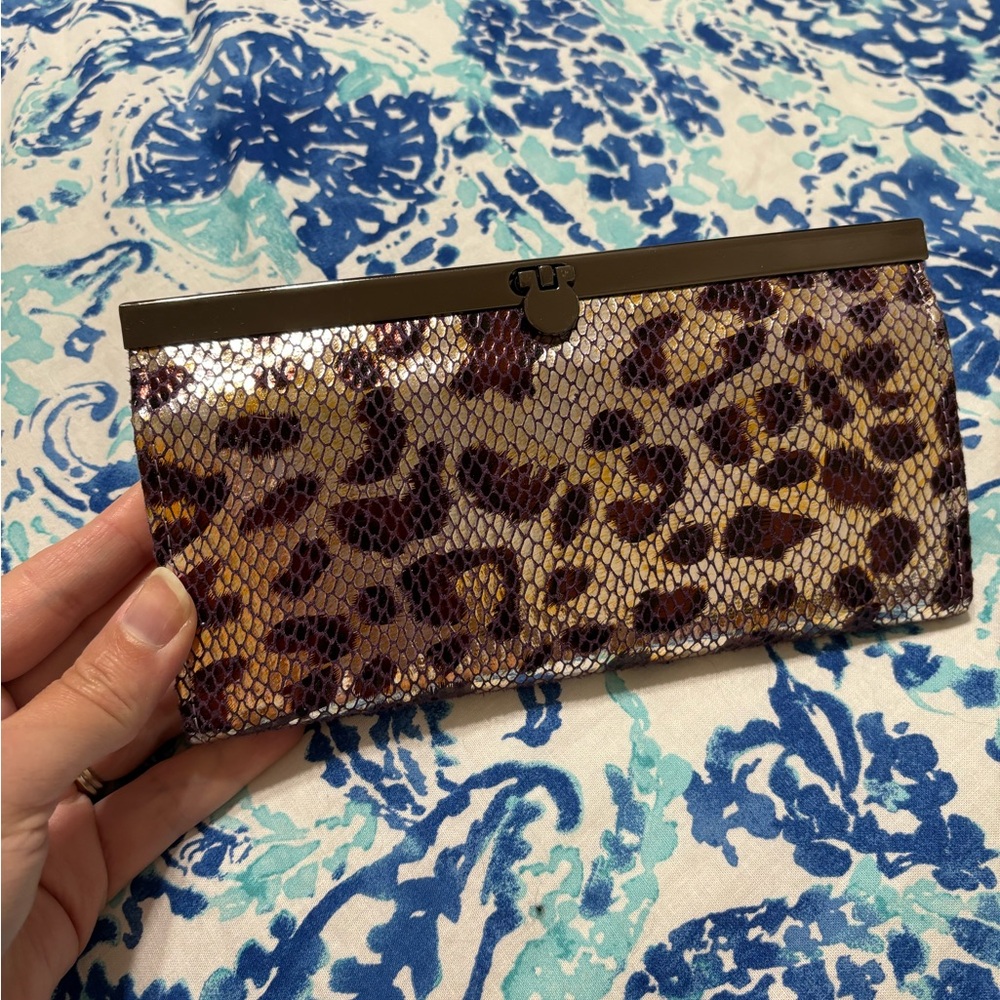 Cache purple metallic leopard clutch